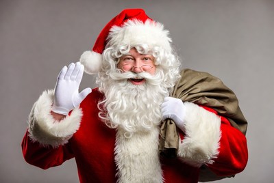 Santa claus waving with sack