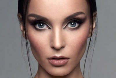 Woman with bold makeup and striking eyes