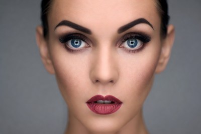 A woman is looking directly at the camera