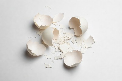 Broken eggshells on a white surface