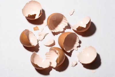 Broken eggshells on white surface