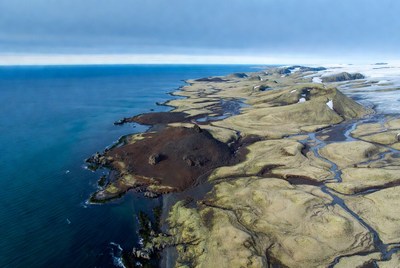 Coastal landscape with melting snow