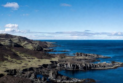 Coastline view with rocky shore and blue water