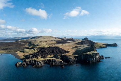 Rocky island in clear water