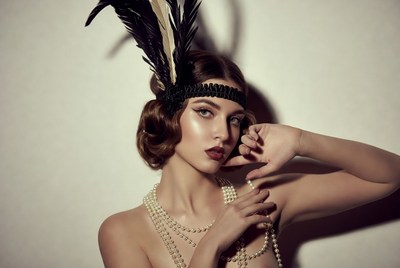Woman in vintage style with feathers