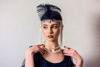 Model in vintage costume with feathers