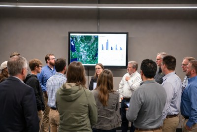 Group discusses data in meeting room