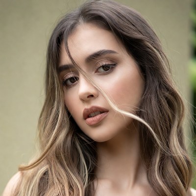 Beautiful portrait of young woman in sunlight