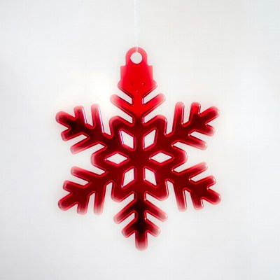 Red snowflake decoration hanging indoors