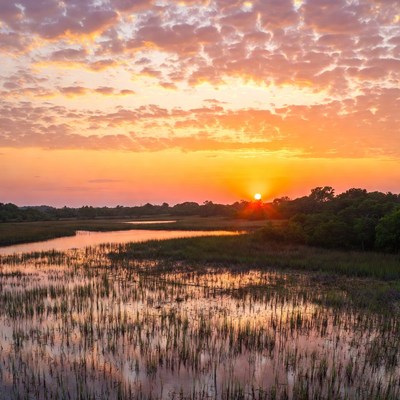 Sunset over a river marsh