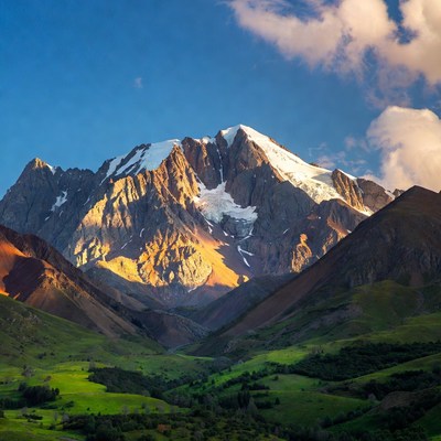 Mountains under blue sky and sunlight