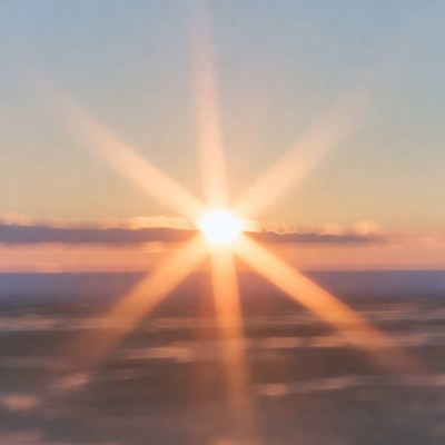 Bright sunrise over horizon with clouds