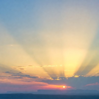 Sunset over the mountains with rays