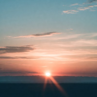 Sunset over distant mountains in the evening