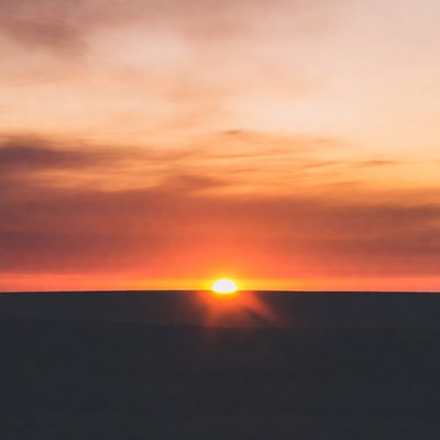 Sunrise over the horizon in the desert