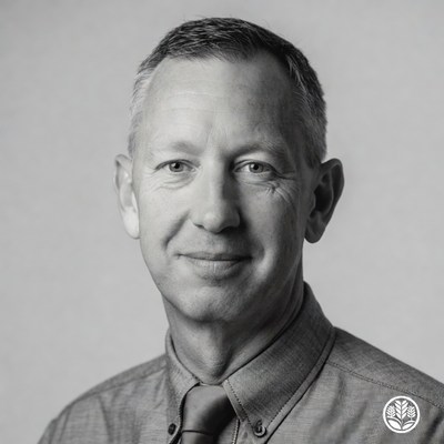 Man poses for a simple portrait indoors