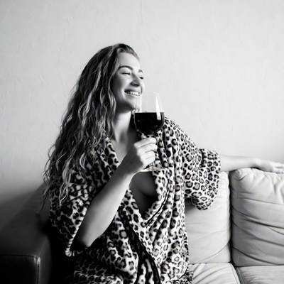 Woman enjoying drink at home