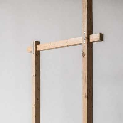 Wooden frame stands on grey wall