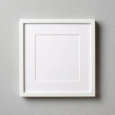 Empty white picture frame on gray wall