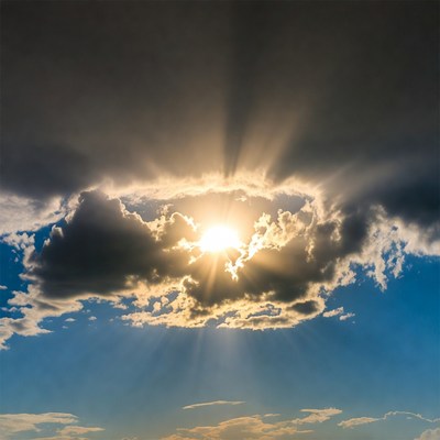 Sun breaking through dark clouds