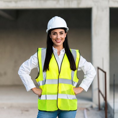 Worker on construction site smiling