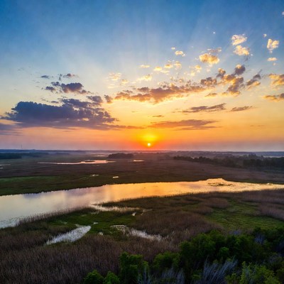 Sunset over a marsh area