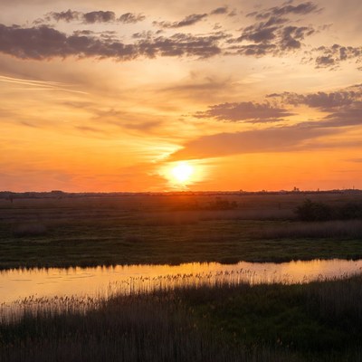 Sunset over river and fields