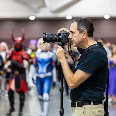 Man taking photos at cosplay event