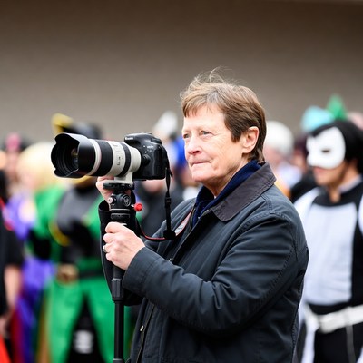 Photographer at event in costume crowd