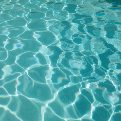 Clear water surface with ripples in sunlight