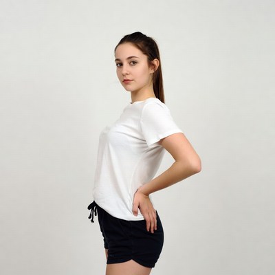 Young woman poses in a studio setting
