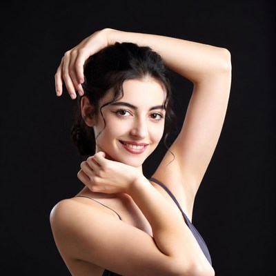 Woman posing with hands on head