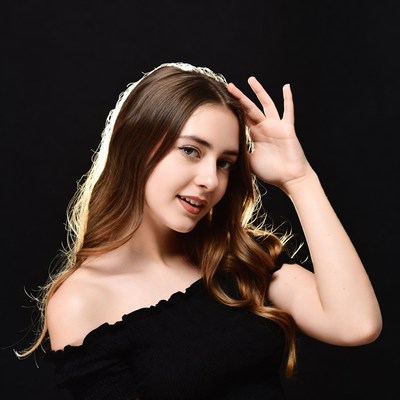 Woman posing with long hair in dark background