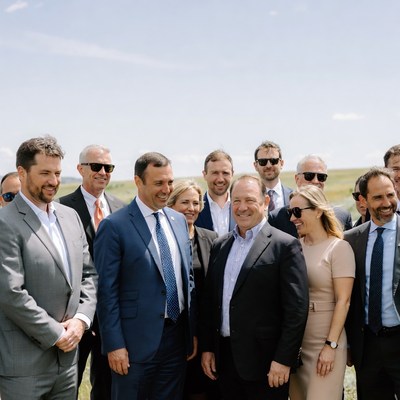 Group of people at outdoor event in sunny weather