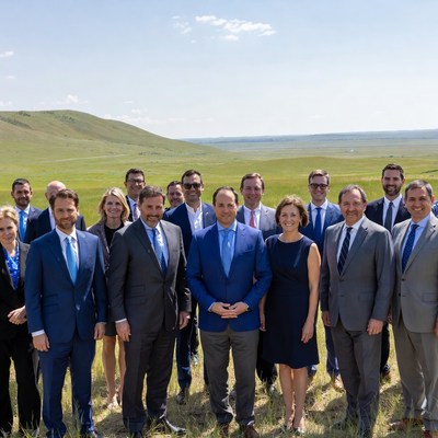 Group picture taken on a green field