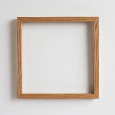 Empty wooden frame on a white wall