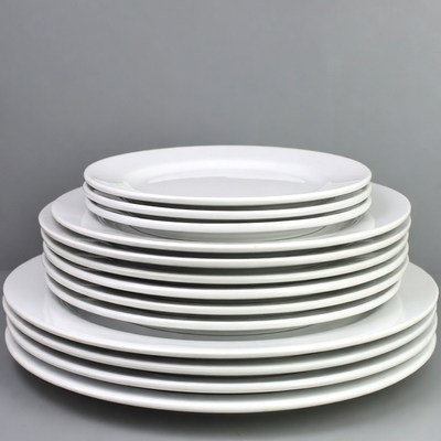 Stacked white plates in display