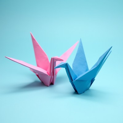 Paper cranes in blue and pink colors