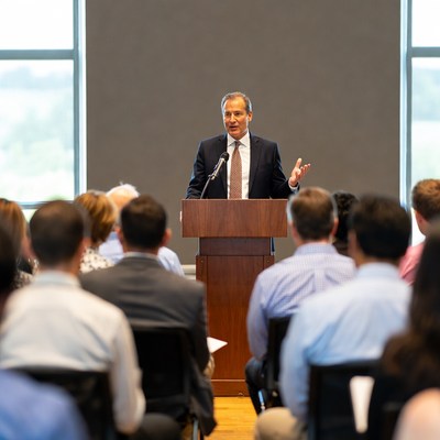 Speaker addresses audience in conference room