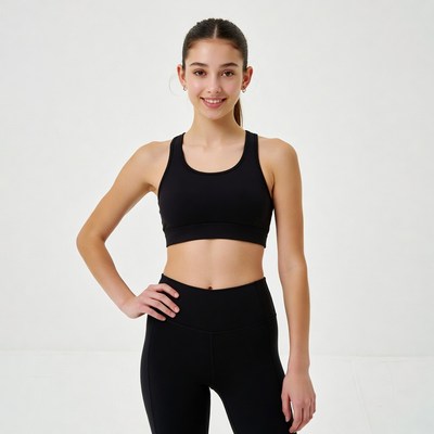 Young woman poses in activewear indoors