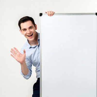 Man waving beside blank board