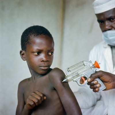 Boy receiving vaccination in clinic