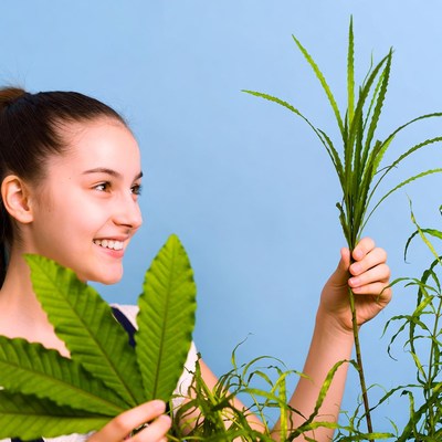 Woman interacts with plants indoors