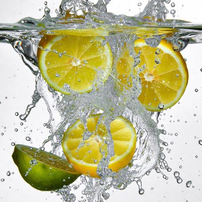 Lemon slices drop into water