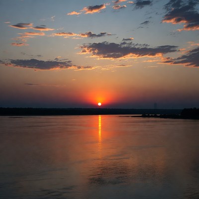 Sunset over the river in summer