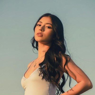 Young woman stands with confidence