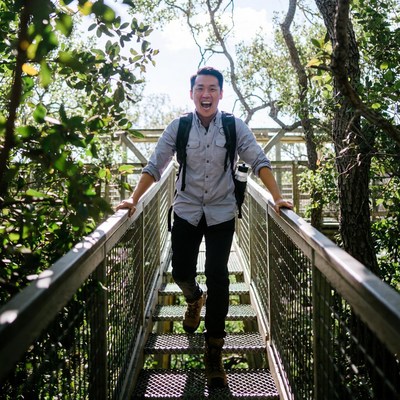 Man walking on bridge in nature