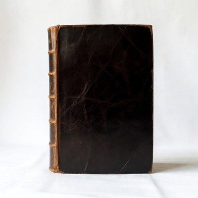 Black leather book on white background