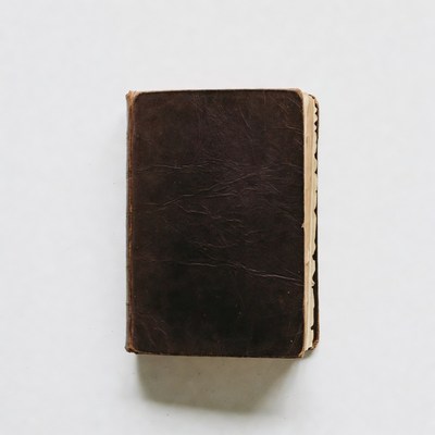 Old brown book on a light surface