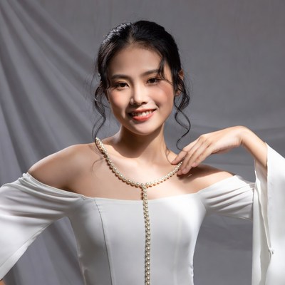 Model poses in white dress